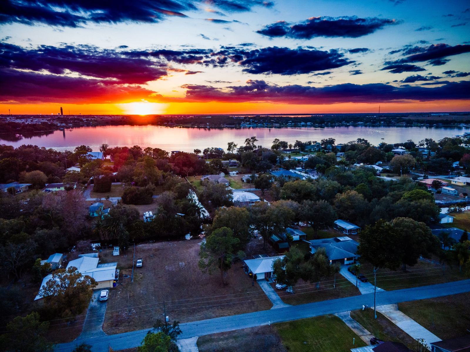 Drone sunset view over Lake Clay and the Lake Placid FL neighborhood
