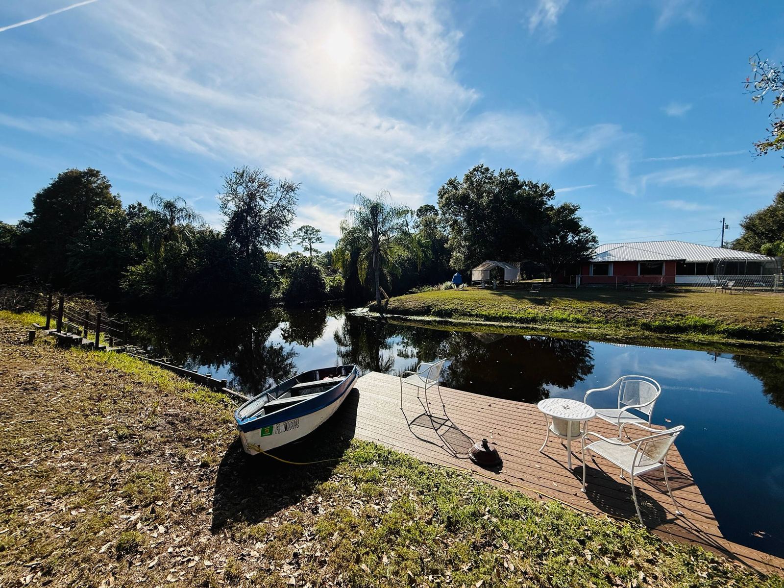 Private dock and rowboat on the canal with access to Lake Clay